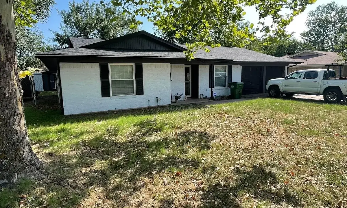 Professional roofing crew working on a residential roof in Oshtemo